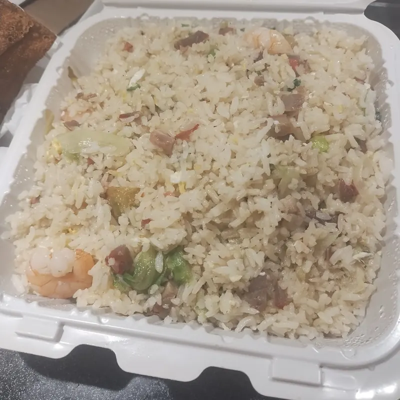 Fried rice with shrimp in a takeout container